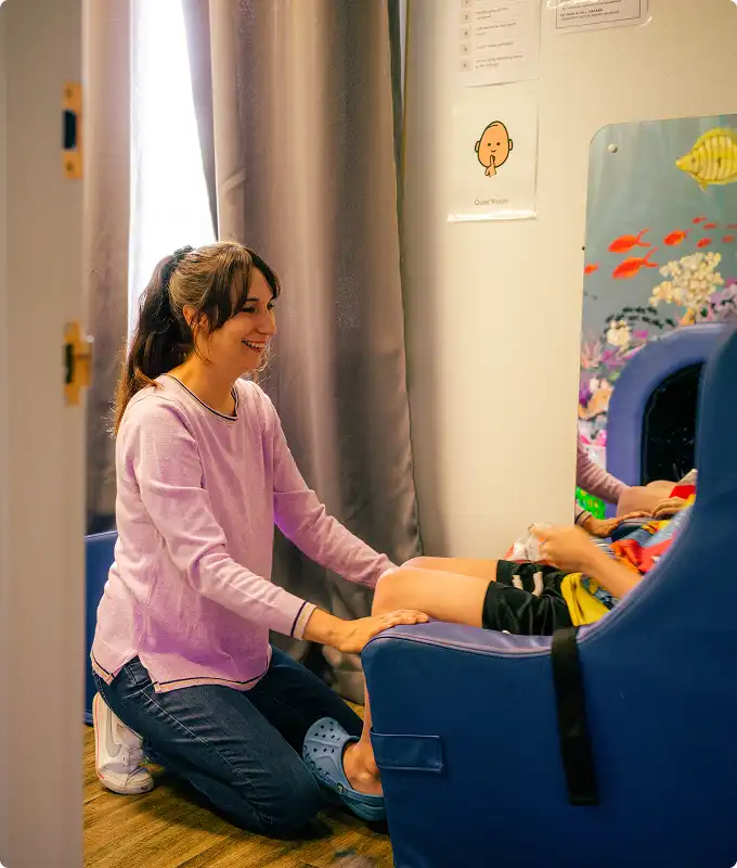 A volunteer works with a child in need